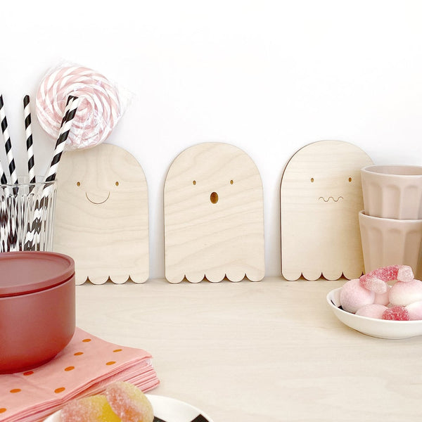 Selection of 3 ghost plywood plaques against wall