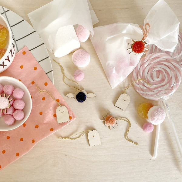 Collection of 5 mini halloween decorations surrounded by sweets