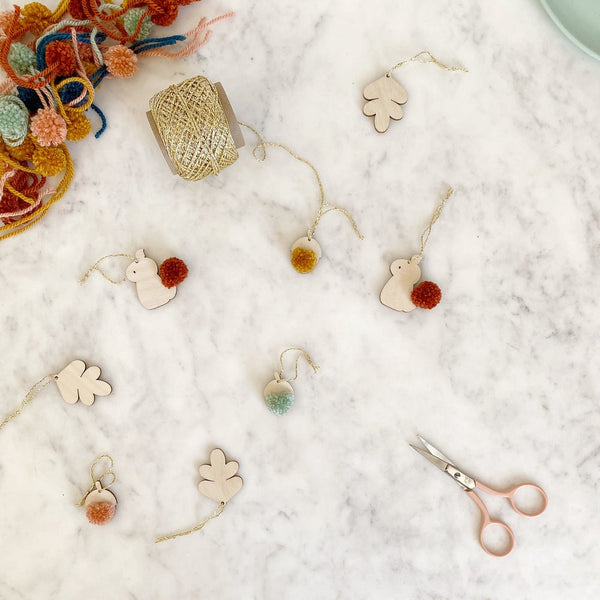 selection of mini decorations scattered with pompoms