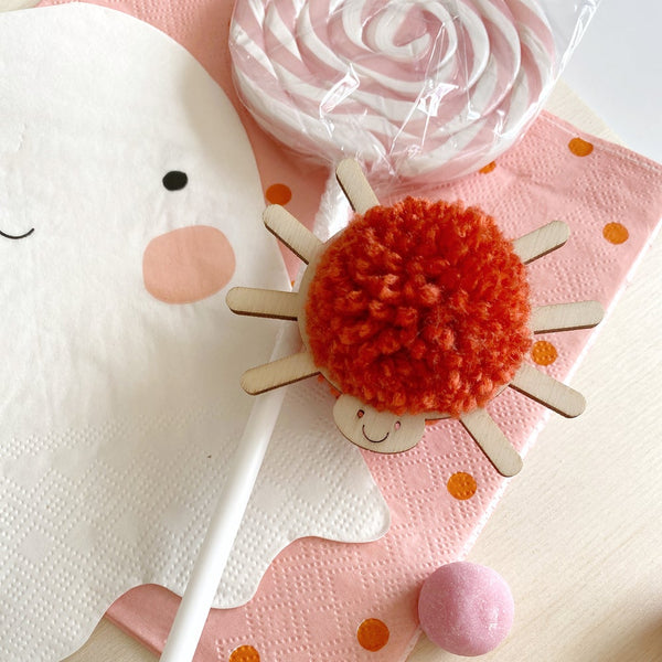 Smiley spider pompom decoration with red pompom