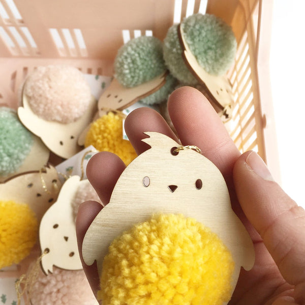 Close up of pompom chick with yellow pompom