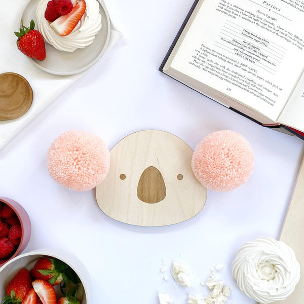 Close up of pompom koala wall plaque with pink pompom ears
