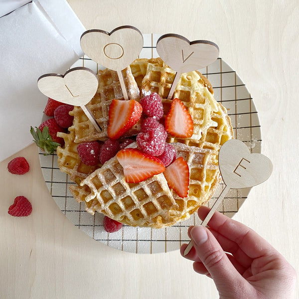 individual love treat toppers inserted into waffles