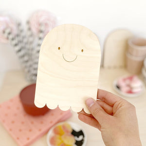 Close up of happy plywood natural halloween ghost plaque