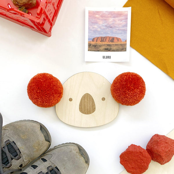 Close up of pompom koala wall plaque with red ears